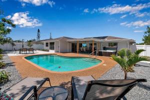 a swimming pool in the backyard of a house at Pool & Play Oasis! All the Amenities & Near AMI! in Bradenton