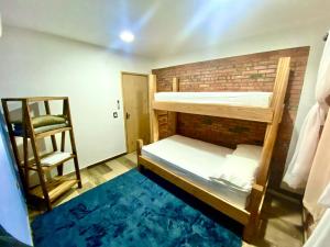 Postel nebo postele na pokoji v ubytování Cabaña Premium Ñakurutu de La Mala Junta + 26 fotografií