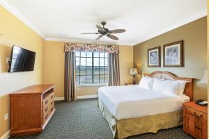 Cama ou camas em um quarto em The Berkley, Orlando