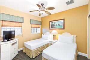 Cama ou camas em um quarto em The Berkley, Orlando