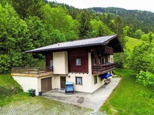 a small house in the middle of a field at Holiday Home Landhaus Rittisweid by Interhome in Schladming