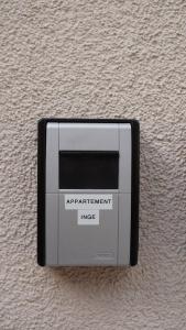 an air enforcement mageeper sitting on a wall at Apartment Inge in Rheinhausen