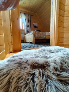 Postel nebo postele na pokoji v ubytování Domek w Zębie z jacuzii i sauną w cenie