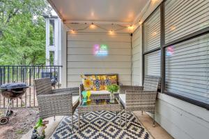 a patio with wicker chairs and a table at Casa Marigold ATX - Cozy Stay - Near DT & Airport in Austin
