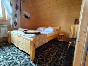 Postel nebo postele na pokoji v ubytování Domek w Zębie z jacuzii i sauną w cenie