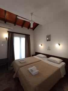 Posteľ alebo postele v izbe v ubytovaní Kalamionas Studios & Apartments