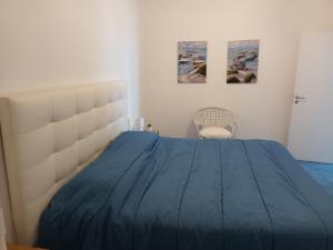 En eller flere senge i et værelse på Casa Emi