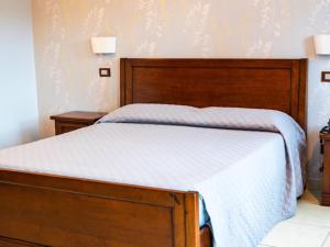 Postel nebo postele na pokoji v ubytování Hotel La Corte di Bacco