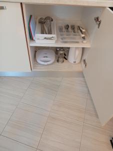 a cupboard with a toilet in a kitchen at LV apartment-in the heart of Parga in Parga +28 photos