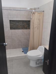 a bathroom with a toilet and a shower at Casa sola in Tlayecac +27 photos