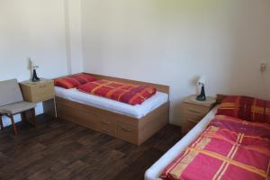Postel nebo postele na pokoji v ubytování Chalupa pod Lysou horou