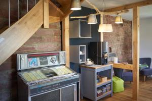 a kitchen with a stove and a microwave at Bauwagen Villa Sweden in Rauenberg