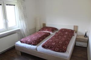 Postel nebo postele na pokoji v ubytování Chalupa pod Lysou horou