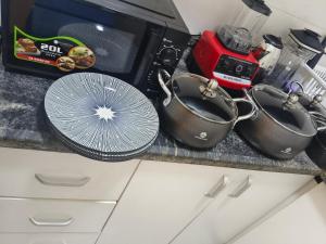 Kuchyň nebo kuchyňský kout v ubytování Studio apartment GRA IKeja