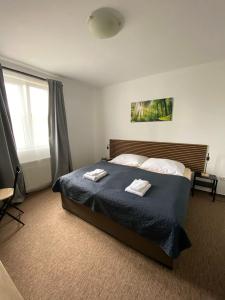 Postel nebo postele na pokoji v ubytování Valnovka Wellness Hotel + 28 fotografií