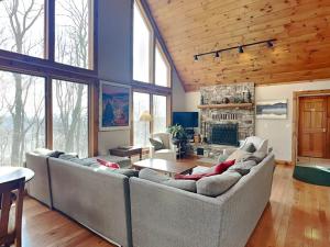 a living room with a couch and a table at One Ski Hill in McHenry +49 photos