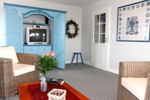 Posezení v ubytování Ferienwohnung Ebbe und Flut Galmsbüll