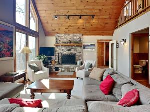 a living room with a couch and a fireplace at One Ski Hill in McHenry