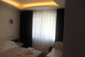 Postel nebo postele na pokoji v ubytování B&B Naiadi Anzio