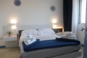 Postel nebo postele na pokoji v ubytování B&B Naiadi Anzio