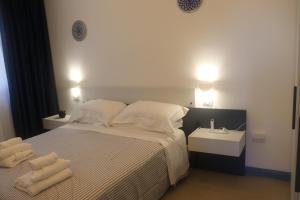 Postel nebo postele na pokoji v ubytování B&B Naiadi Anzio