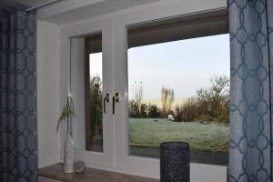 En have udenfor Ferienwohnung Strandläufer Galmsbüll