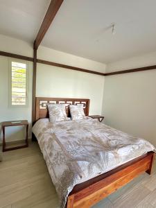 Voodi või voodid majutusasutuse Villa Une Histoire, votre havre de paix à deux pas de la plage toas +10 fotot