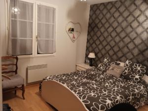 En eller flere senge i et værelse på Chez Thierry et Vero