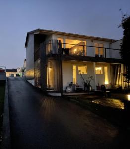a large house with lights on the side of it at Panorama Byfjorden in Stavanger