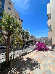a view of a city street with a tree at Saranda View Apartments in Sarandë