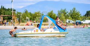 a boy and a girl on a boat in the water at Auravignon in Sorgues