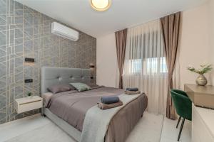 a bedroom with a large bed and a window at Villa Oasis in Zadar +58 photos