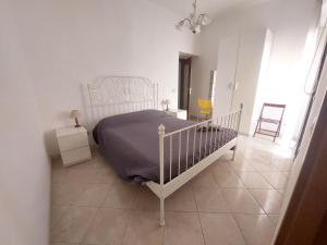 Postel nebo postele na pokoji v ubytování Fronte porto apartment 2