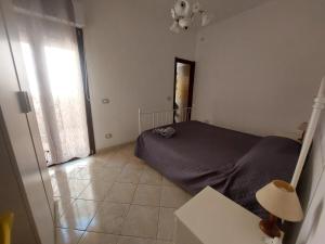 Postel nebo postele na pokoji v ubytování Fronte porto apartment 2
