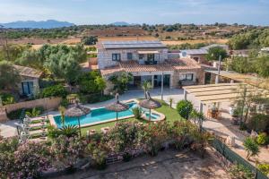 an aerial view of a house with a swimming pool at Agroturisme Es Racó De Maria in Maria de la Salut