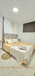 a bedroom with a large bed in a room at Lovely apartment in Costa Adeje by Vapagó Tenerife in Playa Fañabe +38 photos
