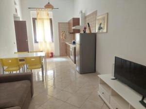 TV a/nebo společenská místnost v ubytování Fronte porto apartment 2