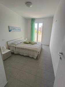 Ένα ή περισσότερα κρεβάτια σε δωμάτιο στο La Casa di Ascanio