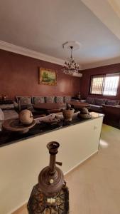a living room with a couch and a table at Villa Massa Luxury, Serenity near Agadir in Sidi Ouassay