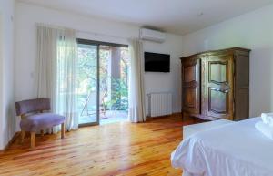 Cama ou camas em um quarto em Casa Lopez