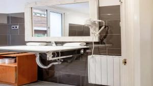 a bathroom with a sink and a mirror at Seaview Villa in Apollonii Lefkada in Athanion