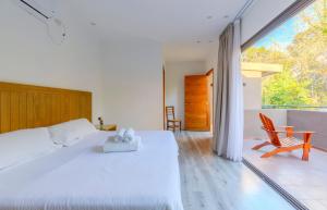 Cama ou camas em um quarto em Casa Lopez