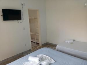 Postel nebo postele na pokoji v ubytování Pousada Recanto do Norte