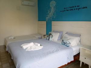 Postel nebo postele na pokoji v ubytování Pousada Recanto do Norte