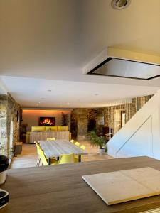 a dining room with a table and a fireplace at Mar do Val in Muxia +133 photos