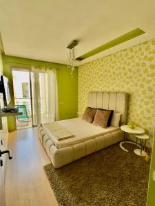 a bedroom with a large bed in a room at Cozy & stylish apartment at Parc Prestigia in Fès +13 photos