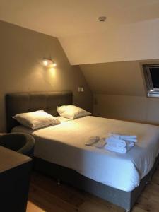 Letto o letti in una camera di Family Hôtel
