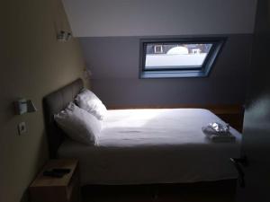 Letto o letti in una camera di Family Hôtel