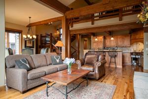 a living room with a couch and a table at Dreamcatcher a spacious Five bedroom home in Winter Park Colorado in Winter Park