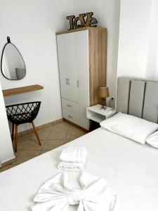 A bed or beds in a room at "Villa Kanavos" apts